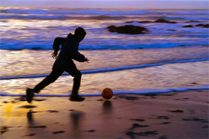 Boy Chasing Ball, Asilomar. Photo © Sandy Yagyu