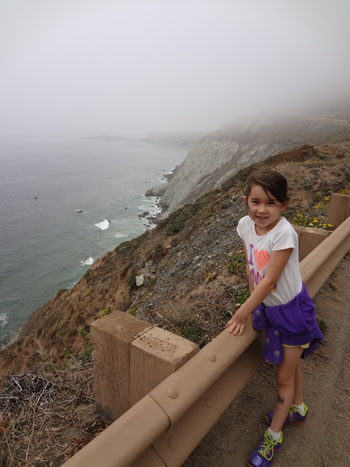 Girl on Devil's Slide Trail next to the ocean
