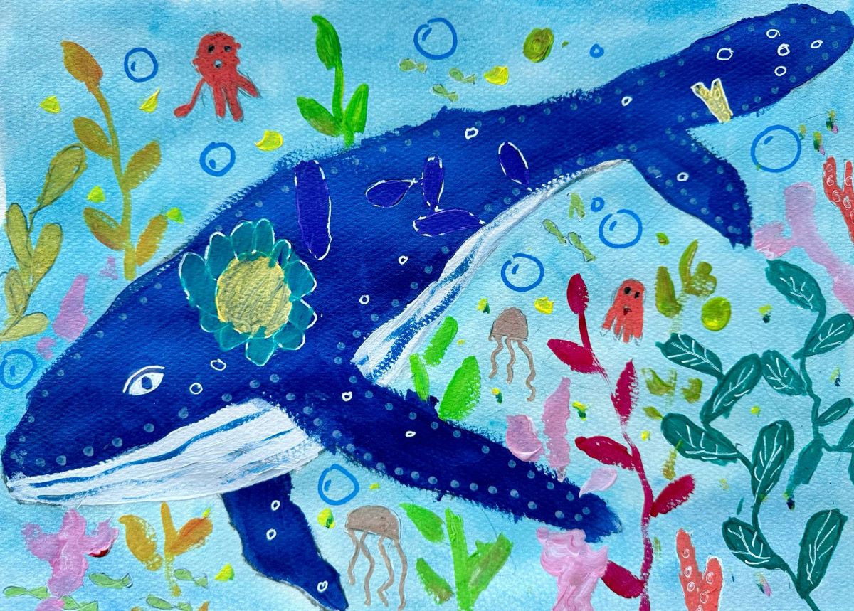 A blue whale is surrounded by colorful ocean creatures.