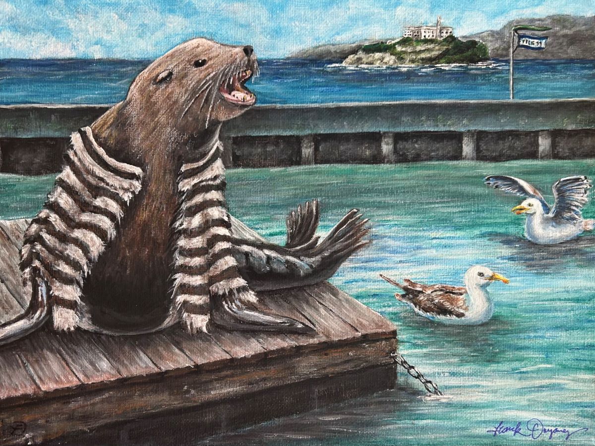 A sea lion is on a dock at Pier 39 with Alcatraz in the background. 
							The sea lion appears to be wearing a black and white striped jacket similar to a stereotypical 
							prisoner uniform. Two gulls are in the water nearby.