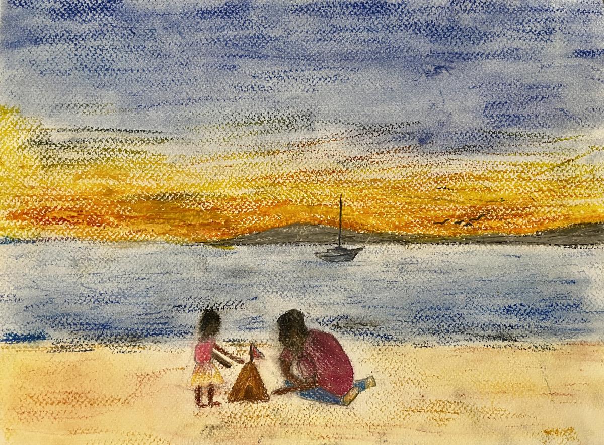 A child is buliding a sandcastle on the beach with an adult. The sun is setting behind them and a sailboat can be seen in the distance.