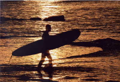 Surfer at Capitola Beach, California