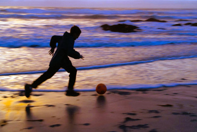 Boy Chasing Ball, Asilomar taken by Sandy Yagyu