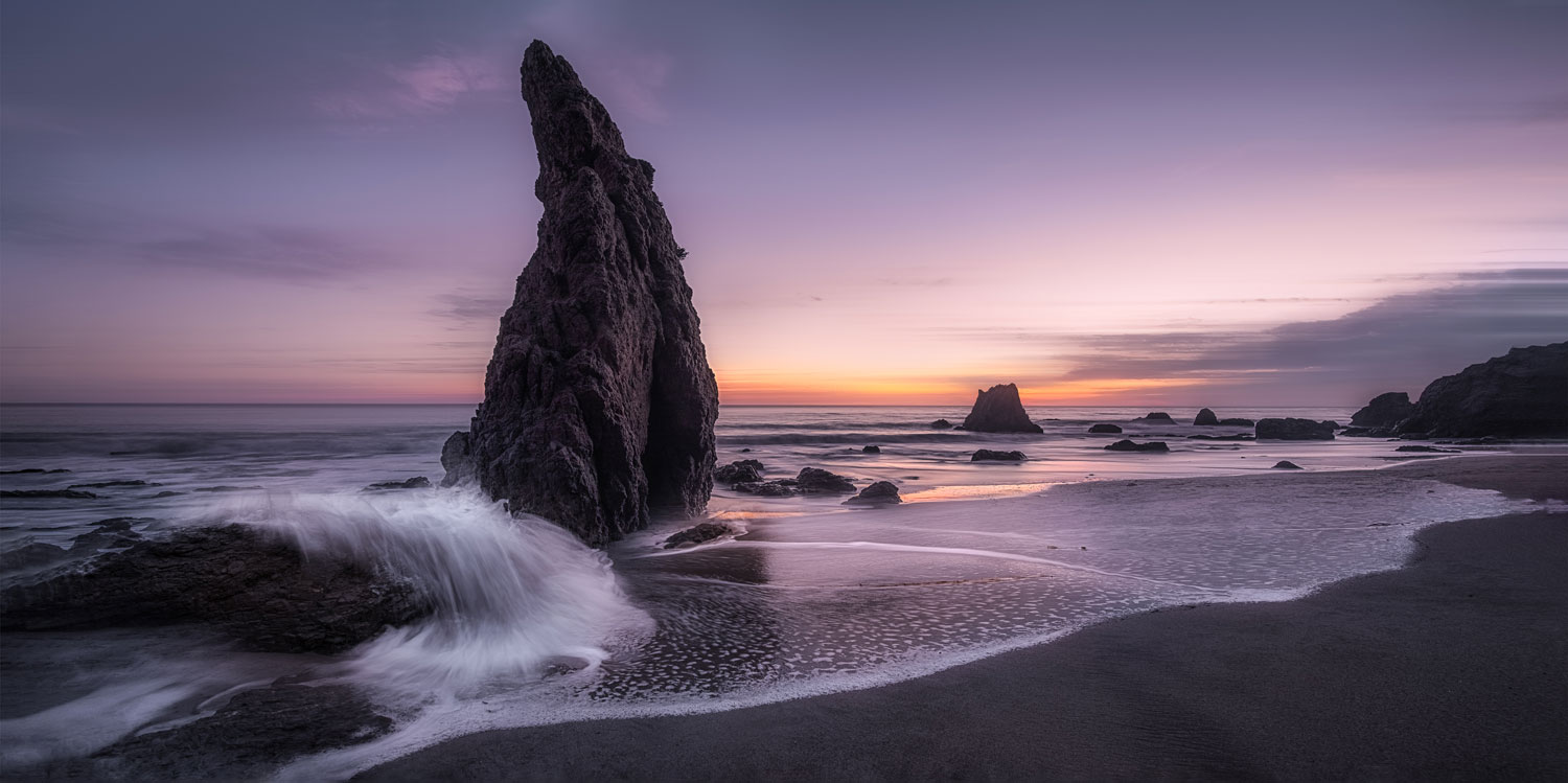 Offshore rocks and waves at twilight, El Matador State Beach