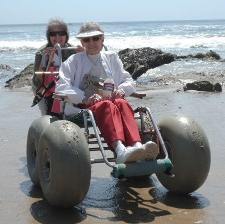 Happy beach wheelchair users