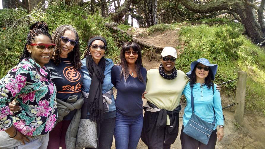 A group of women smile for the camera at Golden Gate National Recreation Area