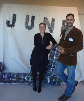 Anna Cummins and Marcus Erikson, 5 Gyres Co-Founders, in front of exhibit