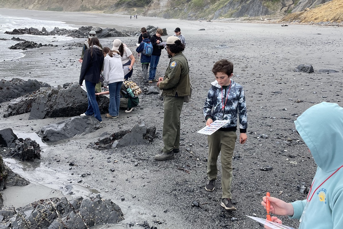 7th grade students led by a State Parks ranger explore tidepools at Sue-Meg State Park